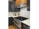 Gourmet kitchen with a professional range, custom cabinets, and elegant marble countertops at 300 Kelly St, Statesville, NC 28677