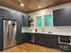 Modern kitchen with stainless steel appliances, custom cabinets, and stylish countertops at 300 Kelly St, Statesville, NC 28677