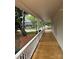 Spacious porch featuring a new wooden floor and a white railing perfect for relaxing outdoors at 300 Kelly St, Statesville, NC 28677