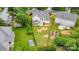 Aerial view of a home with a large, well-maintained backyard including a garden and lush landscaping at 3007 Sandbox Cir, Indian Trail, NC 28079
