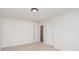Spacious bedroom with neutral carpet and paint, a door and access to a closet for storage at 3007 Sandbox Cir, Indian Trail, NC 28079