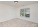 Bright and airy bedroom with a large window and neutral carpet at 3007 Sandbox Cir, Indian Trail, NC 28079