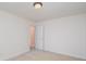 This is a bedroom with white walls, beige carpet, and a door that is slightly open. There is a ceiling light fixture at 3007 Sandbox Cir, Indian Trail, NC 28079