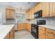 Efficient kitchen featuring wood cabinetry, modern appliances, and ample counter space at 3007 Sandbox Cir, Indian Trail, NC 28079