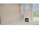 Spacious living room features large windows, neutral walls, carpet, and a fireplace at 3007 Sandbox Cir, Indian Trail, NC 28079