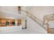 Open concept living room with fireplace, kitchen access, and stairs to second floor at 3007 Sandbox Cir, Indian Trail, NC 28079
