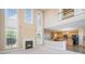 Open concept living room with fireplace, stairs to second floor, and access to the kitchen at 3007 Sandbox Cir, Indian Trail, NC 28079