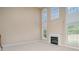 Bright living room featuring tall windows, a fireplace, and neutral carpet at 3007 Sandbox Cir, Indian Trail, NC 28079