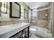 Well-lit bathroom featuring a modern vanity and shower-tub combo with tiled walls at 301 W 10Th St # 402, Charlotte, NC 28202