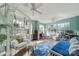 Bright bedroom with swing chair, hardwood floors, large windows with views, and bright teal-green walls at 301 W 10Th St # 402, Charlotte, NC 28202