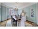 Formal dining room featuring hardwood floors, classic decor, and natural light at 301 W 10Th St # 402, Charlotte, NC 28202