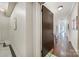 Hallway leading to unit 402, featuring hardwood floors and classic design at 301 W 10Th St # 402, Charlotte, NC 28202
