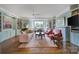 Bright living room with hardwood floors, built-in shelving, and a large bay window at 301 W 10Th St # 402, Charlotte, NC 28202
