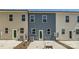 Backyard featuring modern townhomes with neutral toned siding at 3015 Howell Mill Rd, Charlotte, NC 28208