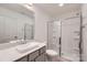 Bathroom featuring a gray vanity, white countertop and glass enclosed shower at 3015 Howell Mill Rd, Charlotte, NC 28208