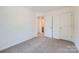 Bedroom featuring neutral carpet and a view into an ensuite bathroom at 3015 Howell Mill Rd, Charlotte, NC 28208