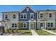 Charming townhome with blue siding, white trim, and a vibrant green front door at 3015 Howell Mill Rd, Charlotte, NC 28208
