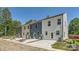 Exterior view of modern townhomes featuring neutral-toned siding at 3015 Howell Mill Rd, Charlotte, NC 28208