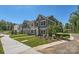 Well-maintained townhomes with manicured lawns and sidewalks, creating a welcoming community at 3015 Howell Mill Rd, Charlotte, NC 28208