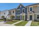 Beautiful new townhome exterior with colorful siding and a well-manicured lawn at 3015 Howell Mill Rd, Charlotte, NC 28208
