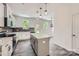 Inviting kitchen features an island with quartz countertops, modern lighting, and stainless steel appliances at 3015 Howell Mill Rd, Charlotte, NC 28208