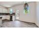 Stylish kitchenette area featuring stainless steel appliances, a door to the outside, and a pendant light at 3015 Howell Mill Rd, Charlotte, NC 28208