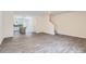 Spacious living area with gray floors, open access to other rooms and a staircase at 3015 Howell Mill Rd, Charlotte, NC 28208