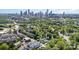 Picturesque aerial view highlighting proximity to city skyline, neighborhood, and roadways at 302 Wesley Heights Way, Charlotte, NC 28208