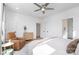 Bright bedroom featuring a large window, natural light, hardwood floors, and a comfortable sitting area at 302 Wesley Heights Way, Charlotte, NC 28208