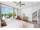 Bright bedroom featuring a large window with natural light, hardwood floors, and a cozy sitting area at 302 Wesley Heights Way, Charlotte, NC 28208