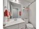 This bathroom features a single vanity, a white shower curtain and stylish modern appointments at 306 Willow Wood Ct, Matthews, NC 28104