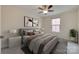 Stylish bedroom featuring a ceiling fan, a window, and a well-decorated interior at 306 Willow Wood Ct, Matthews, NC 28104