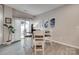 Dining area featuring a round table, white chairs, and modern decor at 306 Willow Wood Ct, Matthews, NC 28104