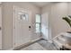 Bright foyer with tile flooring, a front door with glass panes, and neutral walls at 306 Willow Wood Ct, Matthews, NC 28104