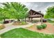 Community gazebo with picnic tables surrounded by trees and greenery offers an outdoor gathering spot at 306 Willow Wood Ct, Matthews, NC 28104