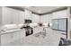 Modern kitchen featuring white cabinets, stainless steel appliances, and granite countertops at 306 Willow Wood Ct, Matthews, NC 28104