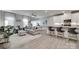 Open concept living space with luxury vinyl floors, neutral paint, and modern decor at 306 Willow Wood Ct, Matthews, NC 28104