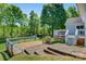 Multi-tiered deck and brick patio offer ample space for outdoor entertaining and relaxation in this backyard at 308 Southland Rd, Huntersville, NC 28078