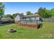 Expansive backyard with a deck, fire pit, and lush lawn, perfect for outdoor entertaining and relaxing at 308 Southland Rd, Huntersville, NC 28078
