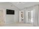 Bedroom featuring TV, access to full bathroom, and sliding glass door to deck at 308 Southland Rd, Huntersville, NC 28078