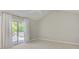 Bright, airy bedroom featuring sliding glass door to private deck at 308 Southland Rd, Huntersville, NC 28078
