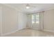Bright bedroom with tile floor, ceiling fan and natural light at 308 Southland Rd, Huntersville, NC 28078