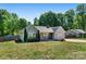 Charming single-story home featuring a well-maintained lawn, mature trees, and classic curb appeal at 308 Southland Rd, Huntersville, NC 28078