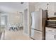 Updated kitchen features stainless steel refrigerator adjacent to dining area at 308 Southland Rd, Huntersville, NC 28078