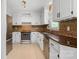 Updated kitchen features white cabinets, stainless steel appliances, and tile backsplash at 308 Southland Rd, Huntersville, NC 28078