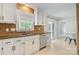Updated kitchen with stainless steel appliances, white cabinets, and granite countertops at 308 Southland Rd, Huntersville, NC 28078