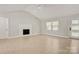 Open living area features a fireplace and large windows, allowing ample natural light at 308 Southland Rd, Huntersville, NC 28078