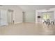 Spacious open-concept living area with tile floors, seamlessly connecting to dining and kitchen at 308 Southland Rd, Huntersville, NC 28078