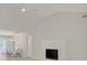 Bright living room featuring a fireplace and vaulted ceilings, adjacent to the dining area at 308 Southland Rd, Huntersville, NC 28078