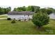 A view of a well-maintained back yard and deck with seating at 3124 Banks St, Lincolnton, NC 28092